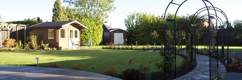 A view of the garden with seating in early morning